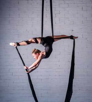 sky dancer displaying durability and strength of professional aerial silks
